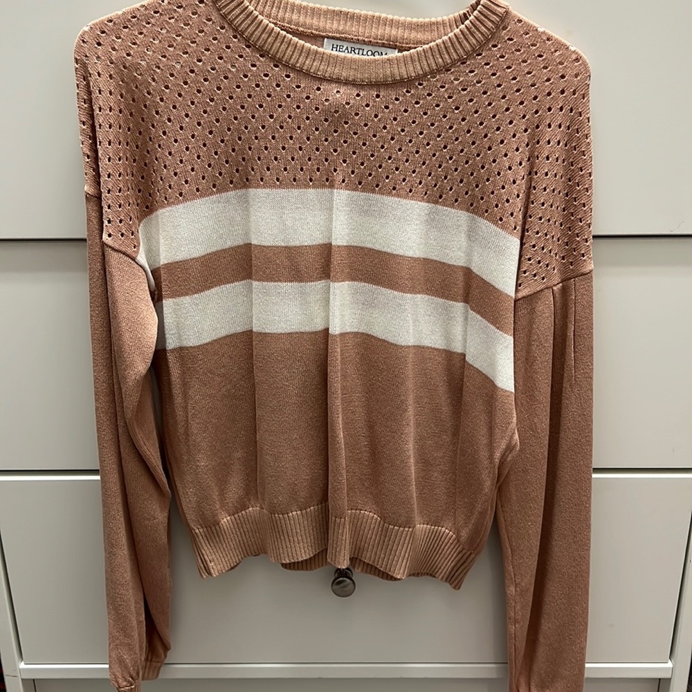 Soft comfy pink sweater with two white stripes!